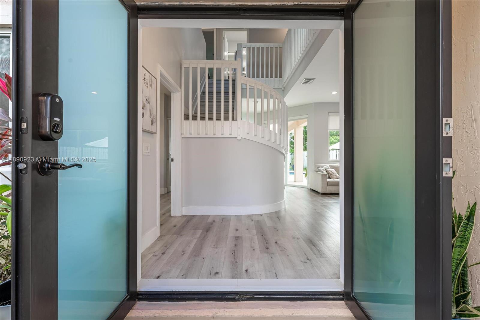 925 Briar Ridge Road Weston, FL 33327 - Photo 3 of 30 a view of entryway with wooden floor