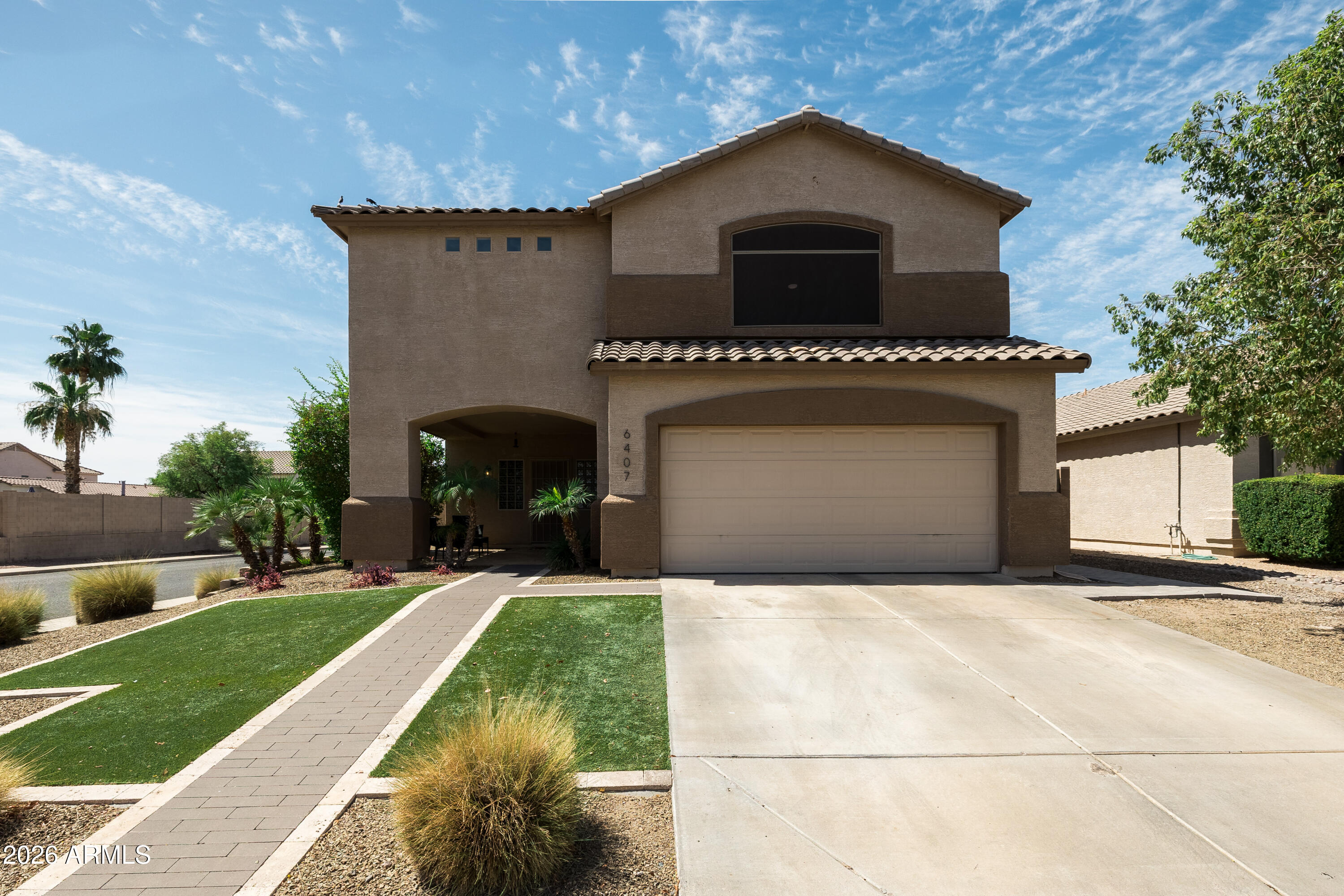 6407 West Saddlehorn Road Phoenix, AZ 85083 - Photo 1 of 41 a front view of a house with a yard and garage