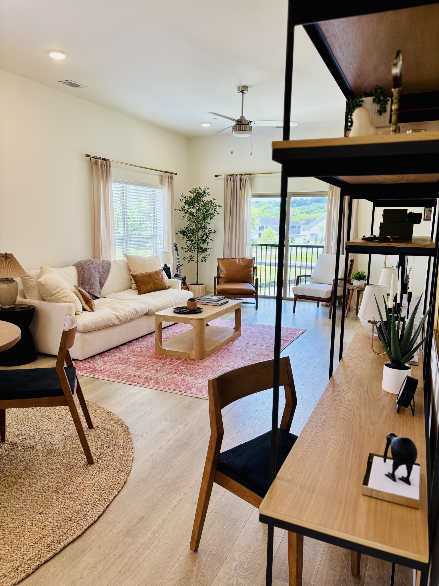 351 Wellows Chase, Unit B Spring Hill, TN 37174 - Photo 11 of 23 a living room with furniture and a floor to ceiling window