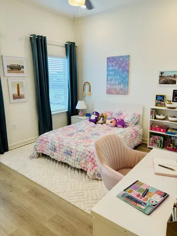 a bedroom with bed and a couch