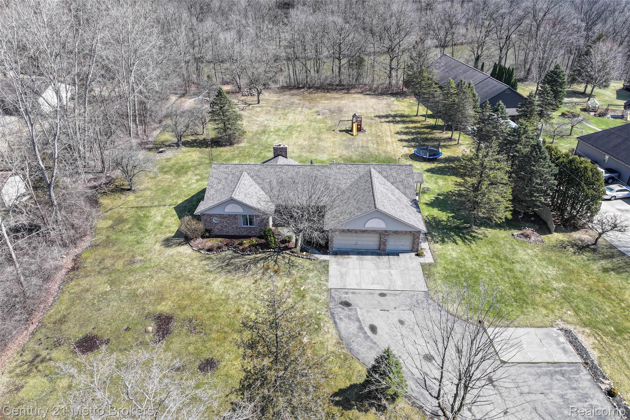 5464 North Seymour Road Flushing, MI 48433 - Photo 46 of 59 Aerial view of property and surrounding area with a tree filled landscape