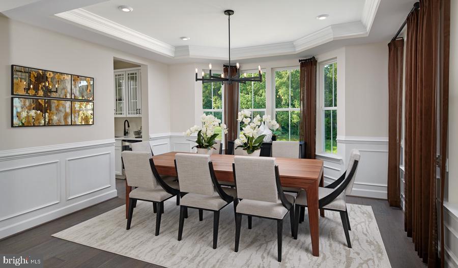 2020 St James Road Accokeek, MD 20607 - Photo 4 of 13 a dining room with furniture a chandelier and wooden floor