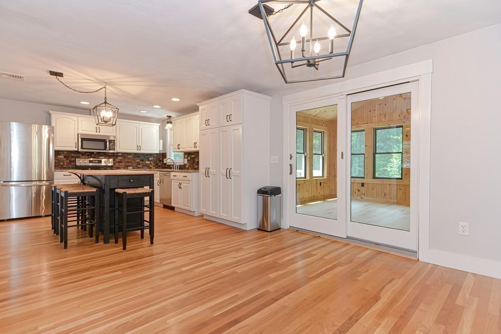 137 Howard Street Northborough, MA 01532 - Photo 12 of 41 a view of kitchen with stainless steel appliances granite countertop a stove and refrigerator