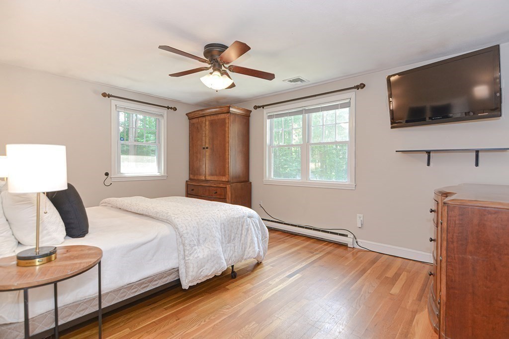 137 Howard Street Northborough, MA 01532 - Photo 19 of 41 a bedroom with a bed and a flat screen tv