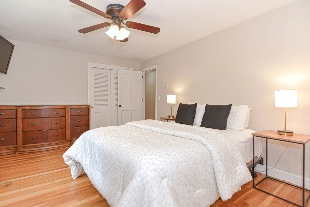 137 Howard Street Northborough, MA 01532 - Photo 20 of 41 a bedroom with a bed and a lamp on the dresser
