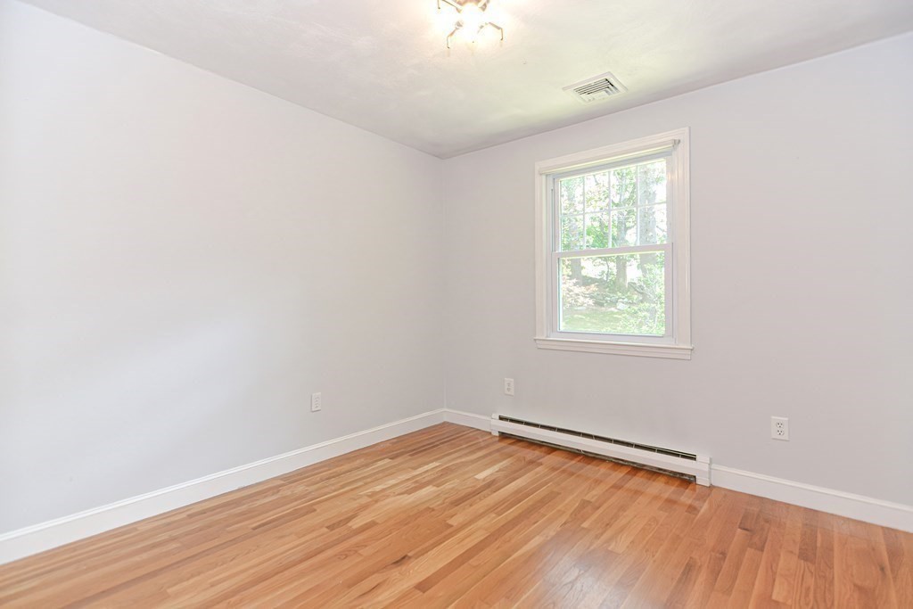 137 Howard Street Northborough, MA 01532 - Photo 22 of 41 an empty room with wooden floor and windows