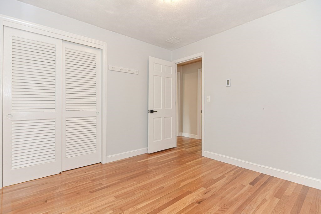 137 Howard Street Northborough, MA 01532 - Photo 23 of 41 an empty room with wooden floor and windows