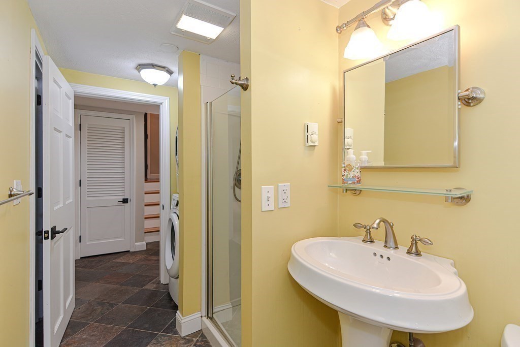 137 Howard Street Northborough, MA 01532 - Photo 27 of 41 a bathroom with a sink and a mirror