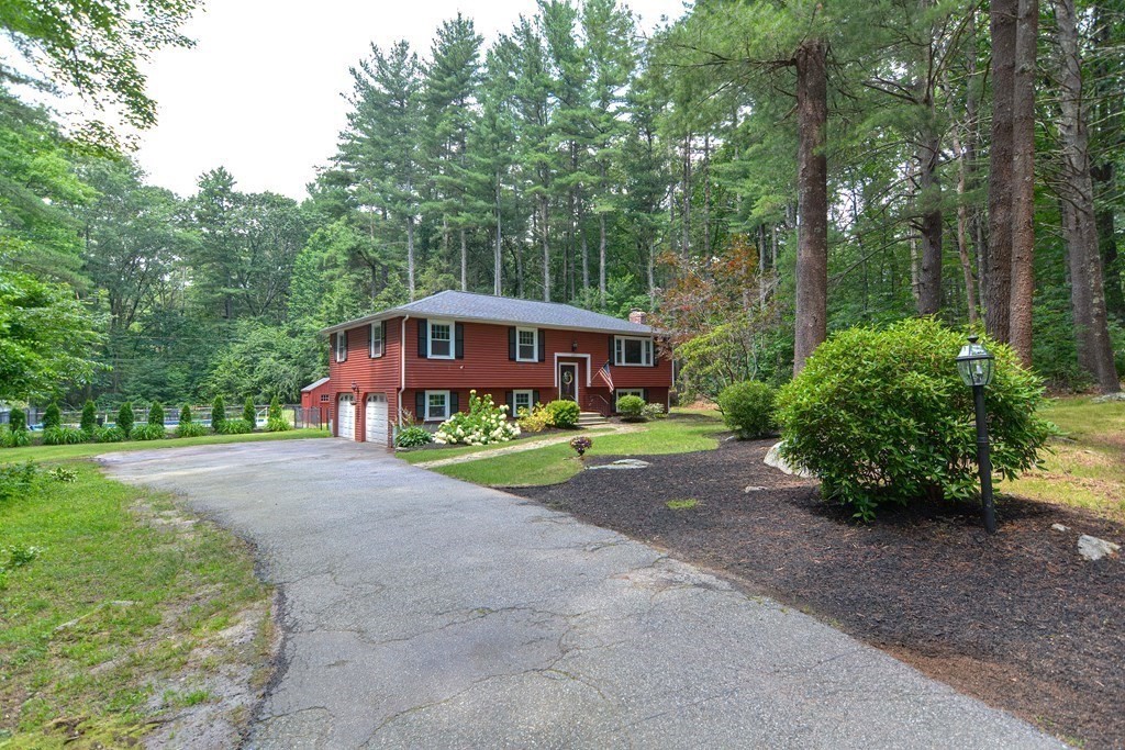 137 Howard Street Northborough, MA 01532 - Photo 3 of 41 a front view of a house with yard and green space