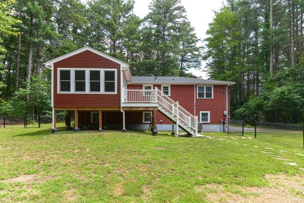 137 Howard Street Northborough, MA 01532 - Photo 33 of 41 a front view of house with yard and green space