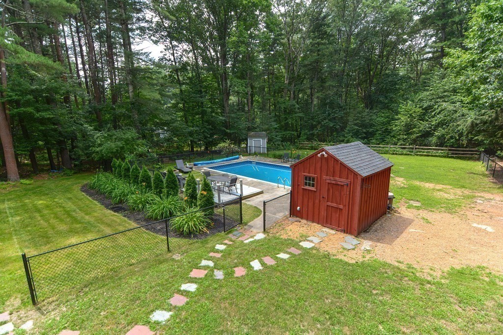 137 Howard Street Northborough, MA 01532 - Photo 35 of 41 a view of a chair and table in the garden