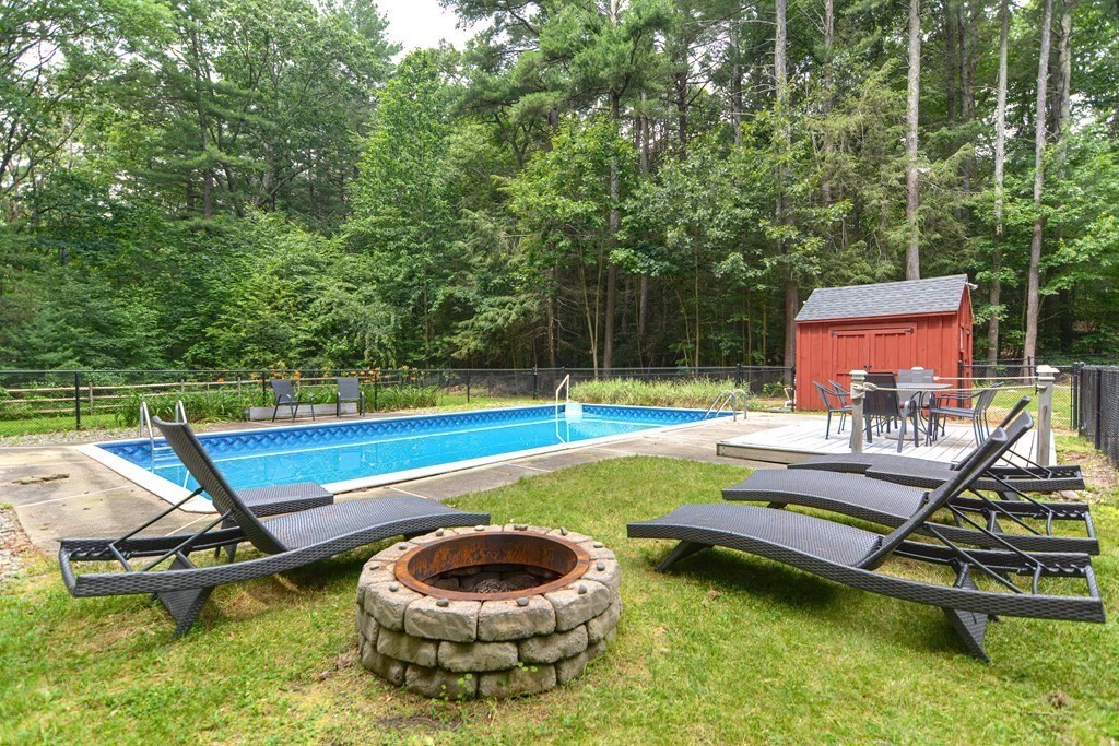 137 Howard Street Northborough, MA 01532 - Photo 38 of 41 a view of a swimming pool with a lounge chair