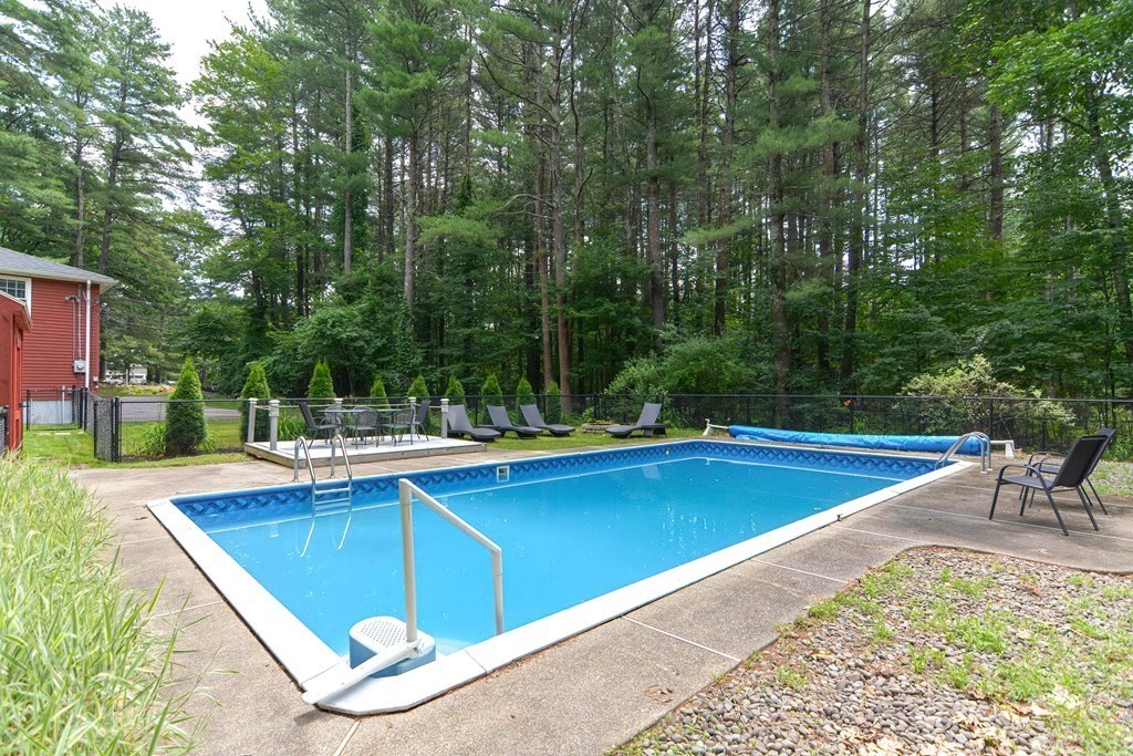 137 Howard Street Northborough, MA 01532 - Photo 39 of 41 a view of a swimming pool with a yard