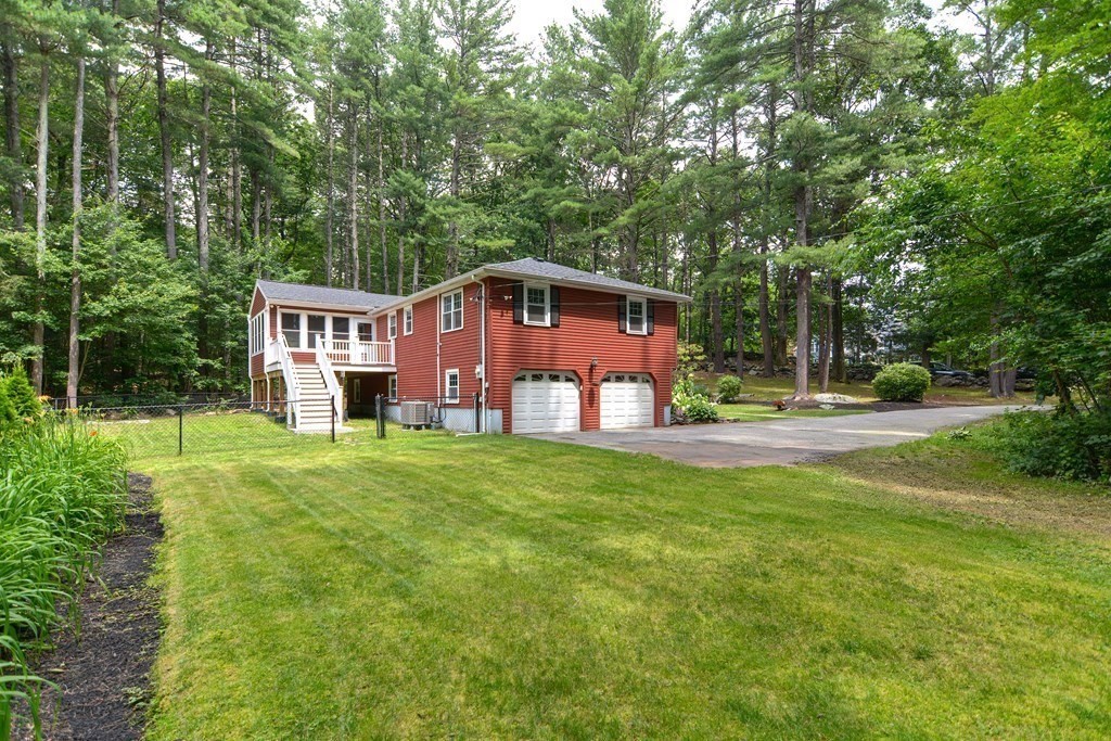 137 Howard Street Northborough, MA 01532 - Photo 4 of 41 a front view of a house with a yard