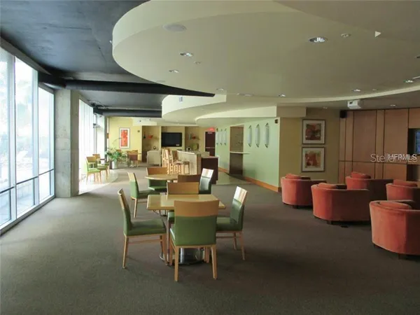 a view of a dining room with furniture window and outside view
