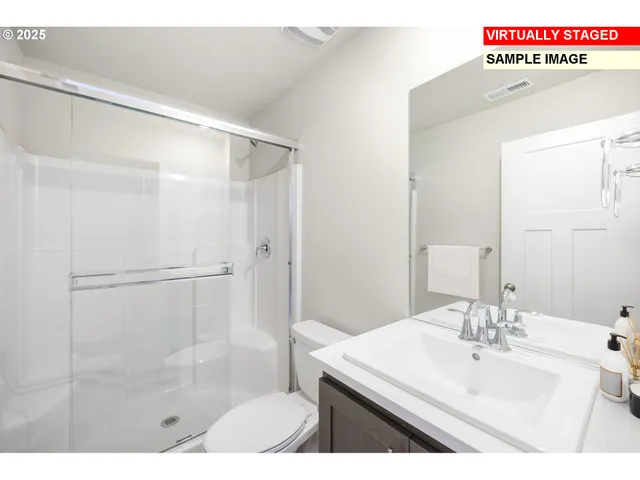 a bathroom with a sink a mirror and a shower