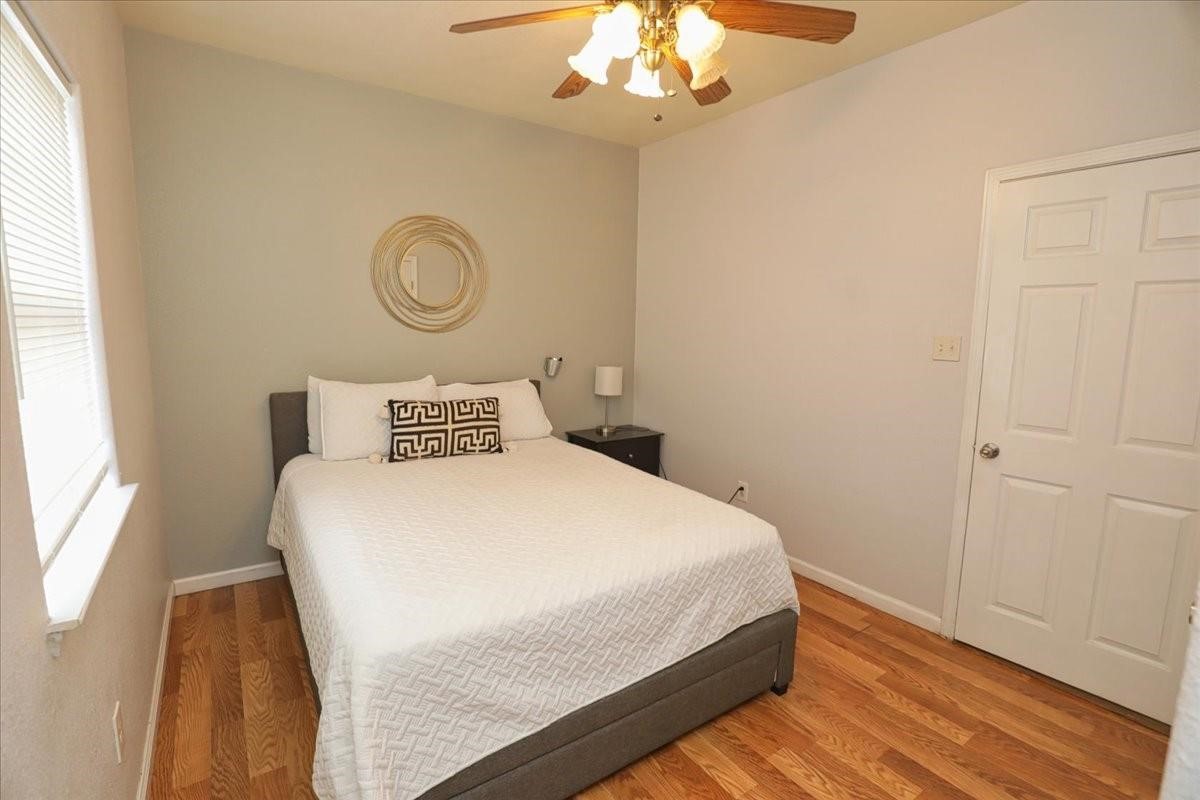 13121 Vickery Street, Unit 5 Houston, TX 77039 - Photo 13 of 40 a bedroom with a bed and window