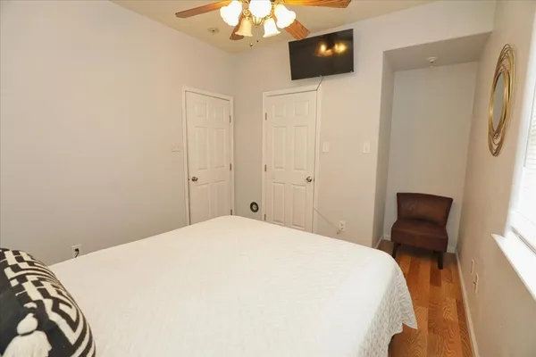 a bedroom with a bed and a chair