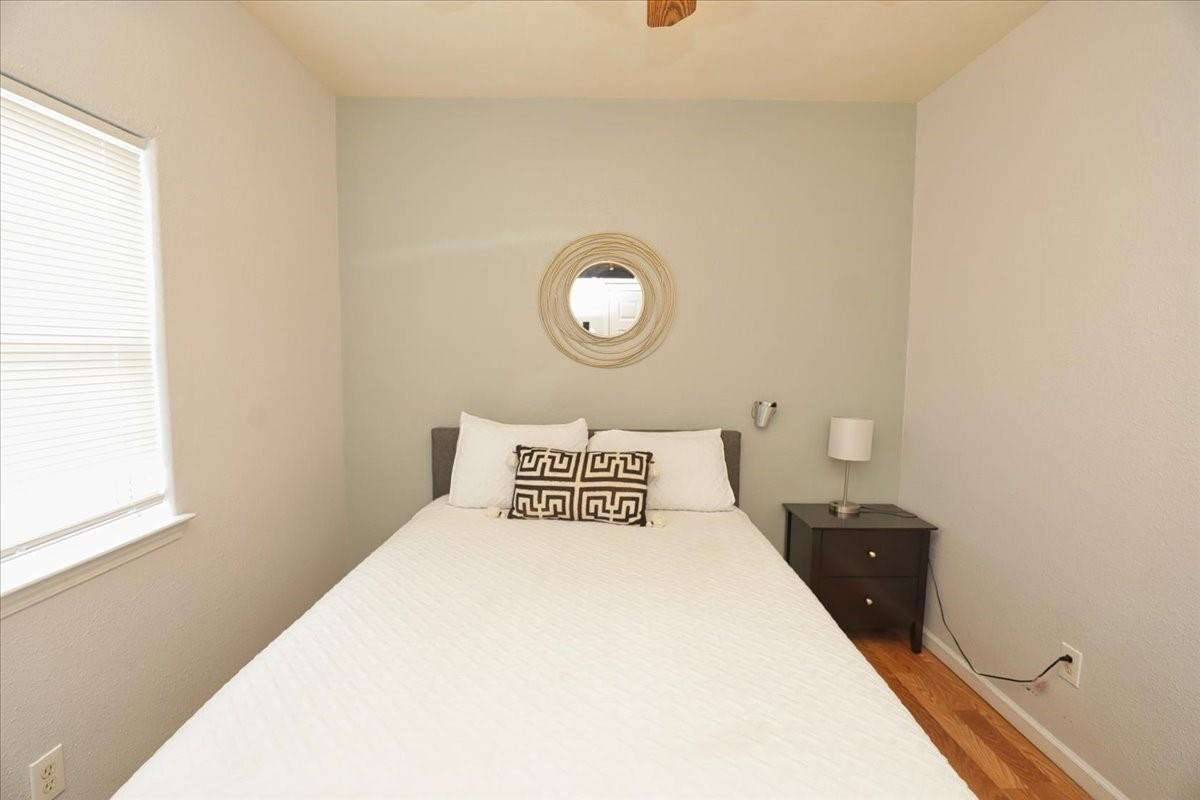 13121 Vickery Street, Unit 5 Houston, TX 77039 - Photo 15 of 40 a bedroom with a bed and a window