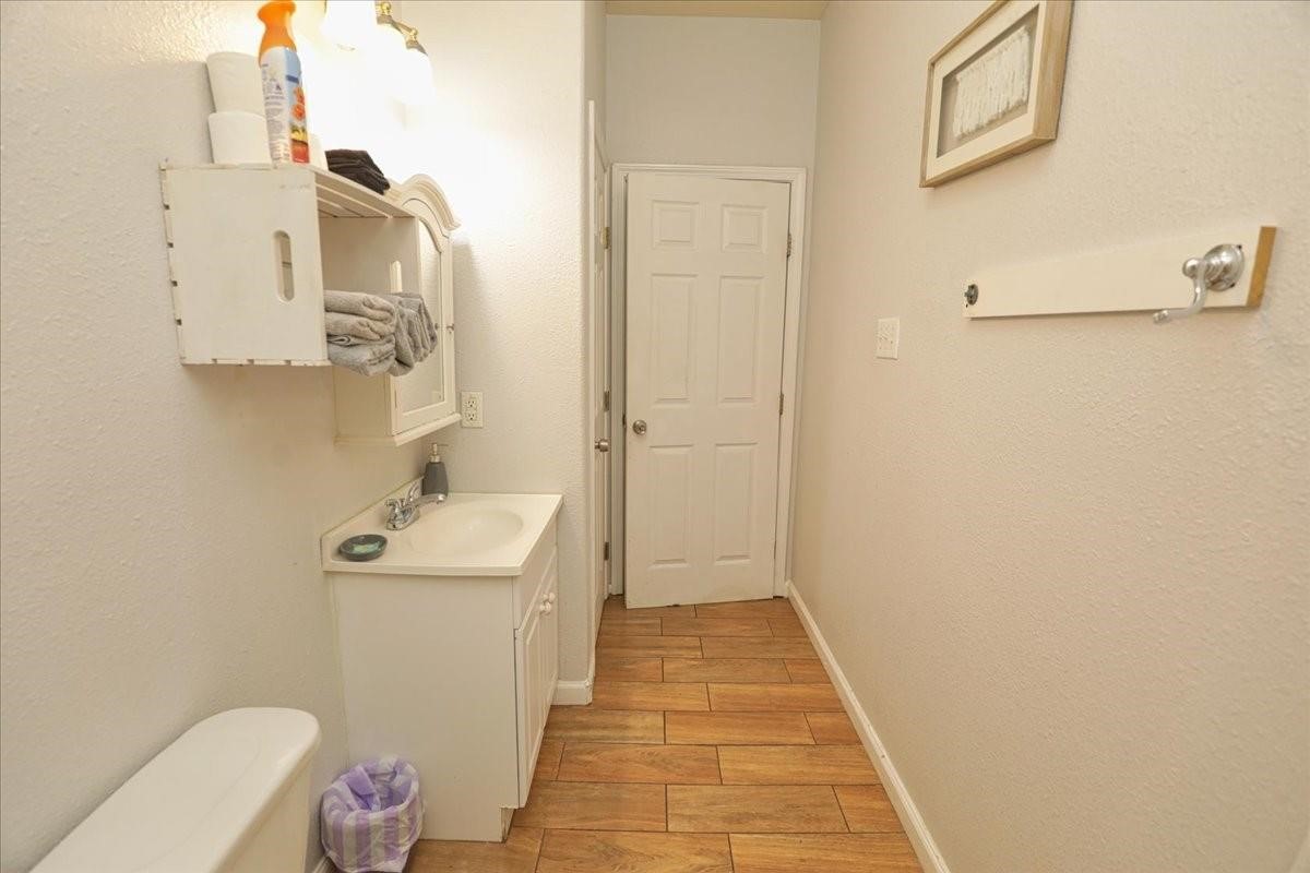 13121 Vickery Street, Unit 5 Houston, TX 77039 - Photo 17 of 40 a bathroom with a sink a toilet and shower