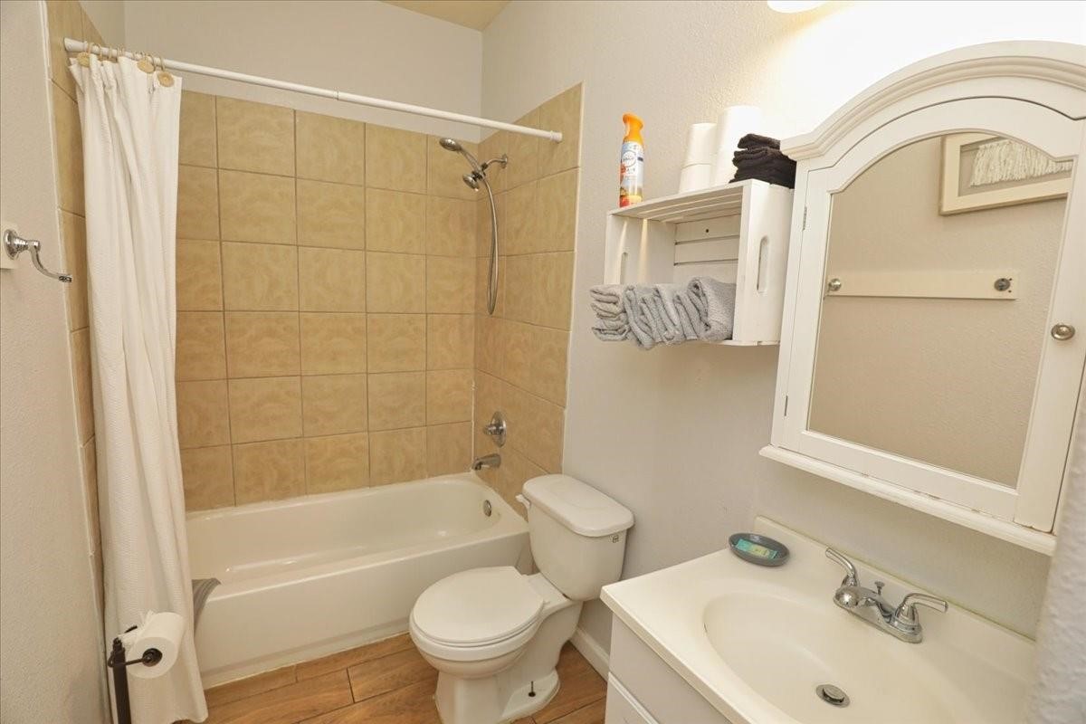 13121 Vickery Street, Unit 5 Houston, TX 77039 - Photo 19 of 40 a bathroom with a sink toilet and shower