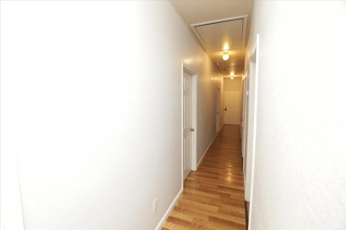 13121 Vickery Street, Unit 5 Houston, TX 77039 - Photo 27 of 40 a view of a hallway with a white walls
