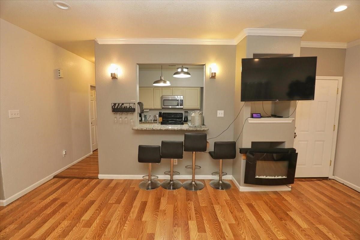 13121 Vickery Street, Unit 5 Houston, TX 77039 - Photo 35 of 40 a living room with furniture and a flat screen tv