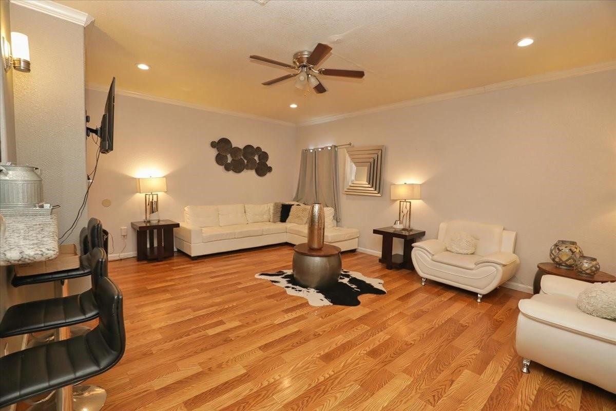 13121 Vickery Street, Unit 5 Houston, TX 77039 - Photo 37 of 40 a living room with furniture and a chandelier