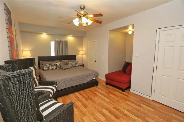 a bedroom with a bed and closet