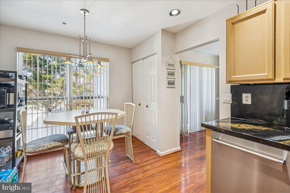 7536 Maury Road Windsor Mill, MD 21244 - Photo 15 of 36 a view of a dining room with furniture window and wooden floor