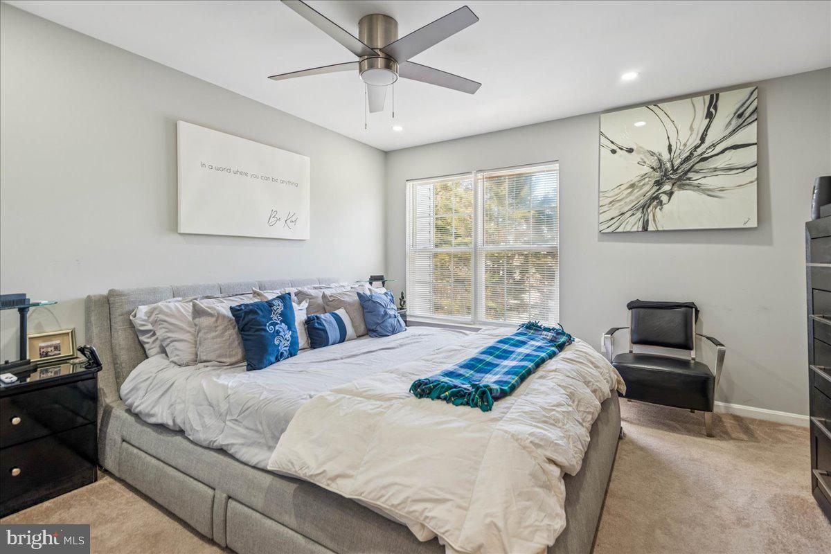 7536 Maury Road Windsor Mill, MD 21244 - Photo 17 of 36 a bedroom with a large bed and a window