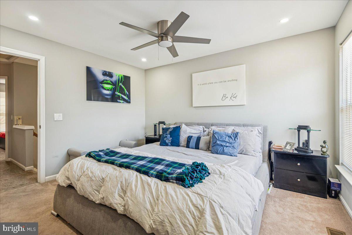 7536 Maury Road Windsor Mill, MD 21244 - Photo 19 of 36 a bedroom with a bed and a painting