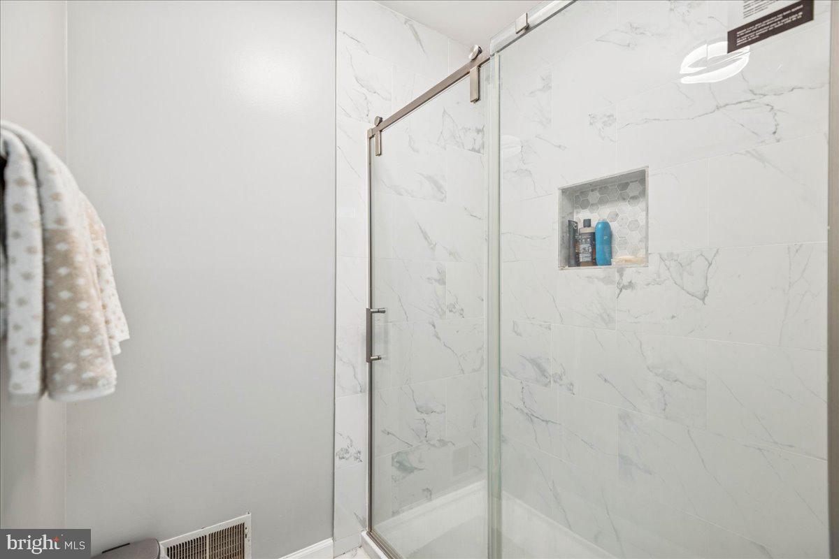 7536 Maury Road Windsor Mill, MD 21244 - Photo 21 of 36 a bathroom with a shower