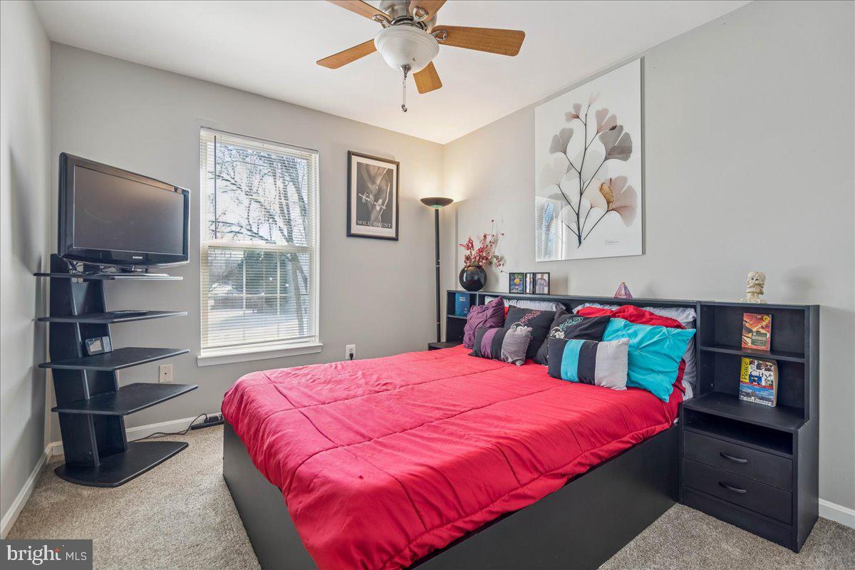 7536 Maury Road Windsor Mill, MD 21244 - Photo 22 of 36 a bedroom with a bed and a flat screen tv