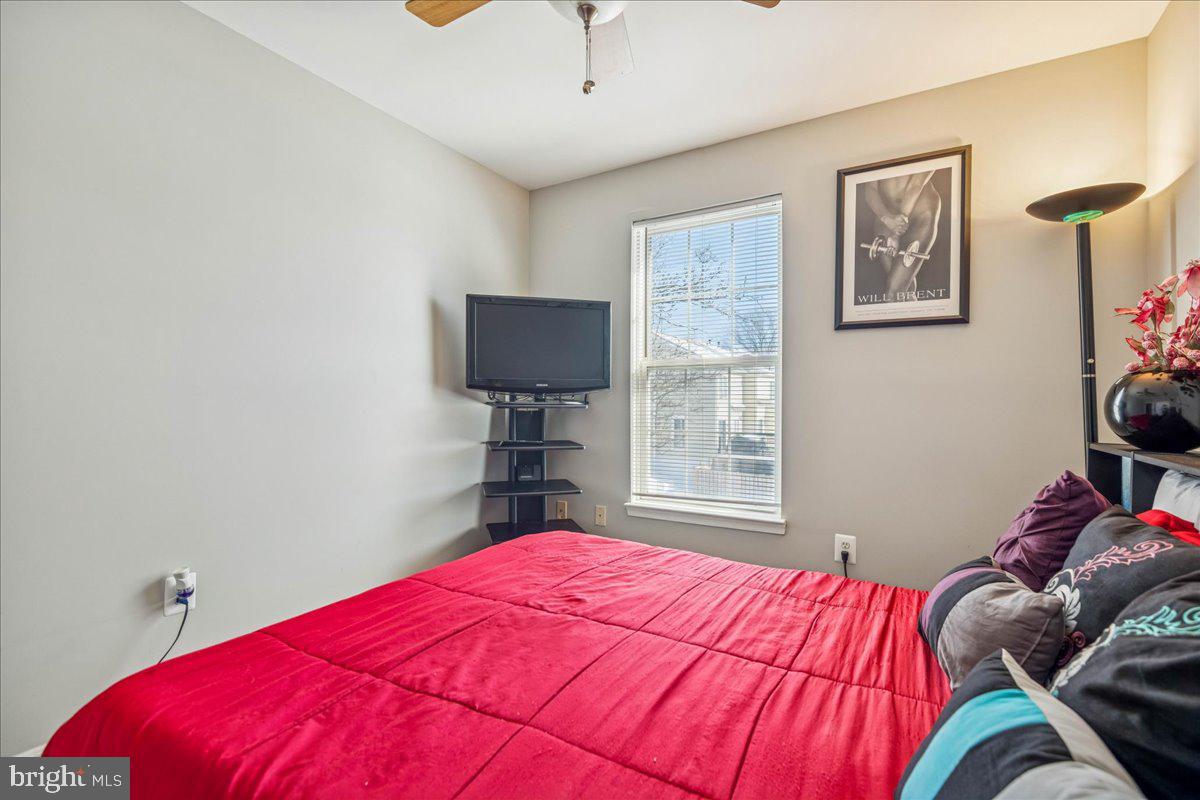 7536 Maury Road Windsor Mill, MD 21244 - Photo 23 of 36 a bedroom with a bed and a flat screen tv
