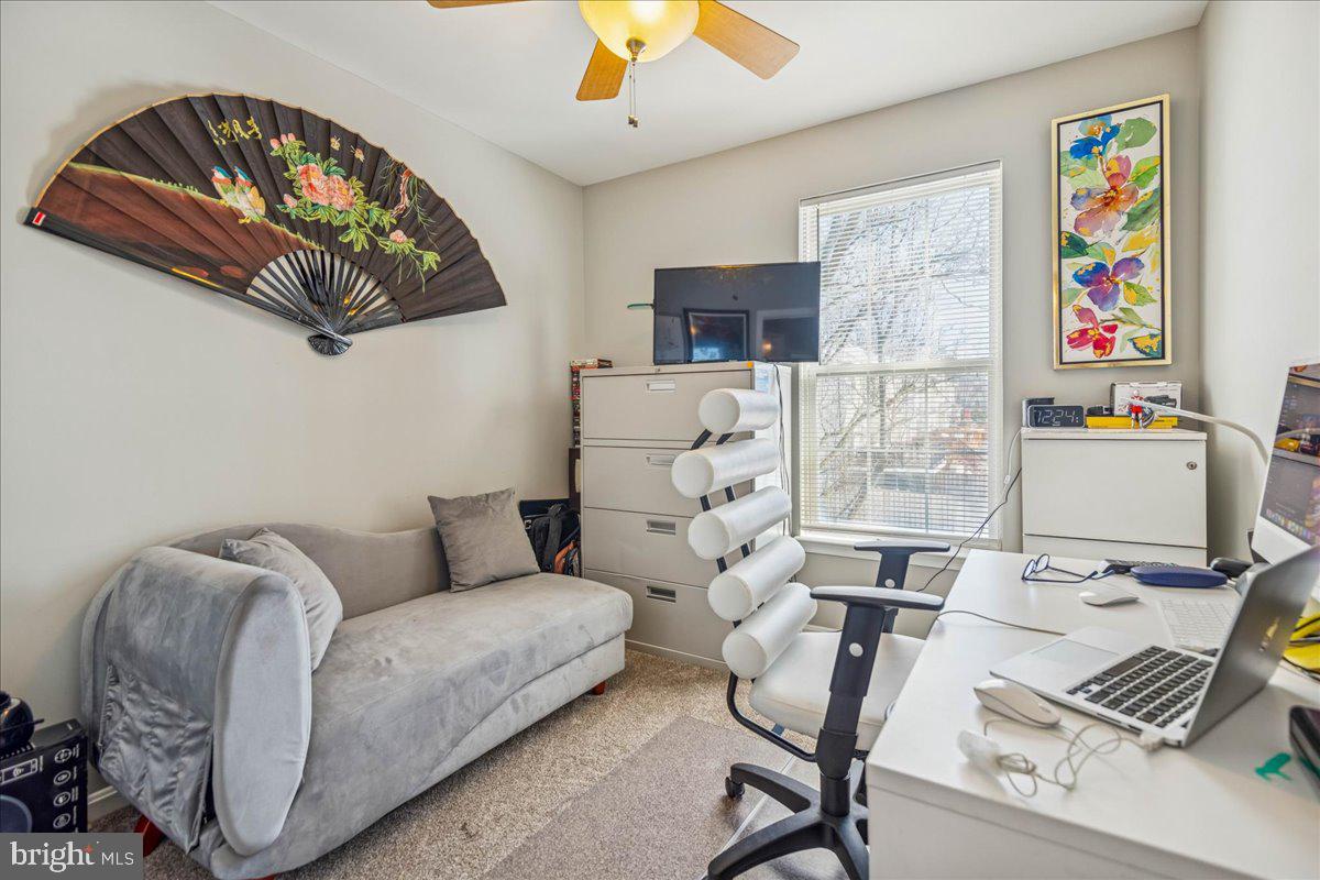 7536 Maury Road Windsor Mill, MD 21244 - Photo 24 of 36 a living room with furniture and a flat screen tv