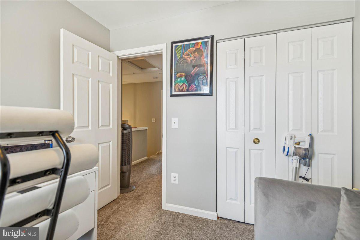 7536 Maury Road Windsor Mill, MD 21244 - Photo 25 of 36 a view of a livingroom with furniture and windows
