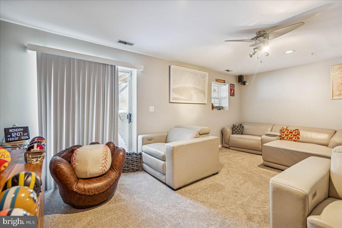 7536 Maury Road Windsor Mill, MD 21244 - Photo 30 of 36 a living room with furniture and a large window