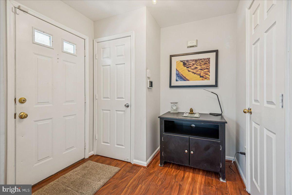 7536 Maury Road Windsor Mill, MD 21244 - Photo 4 of 36 a view of a livingroom with wooden floor