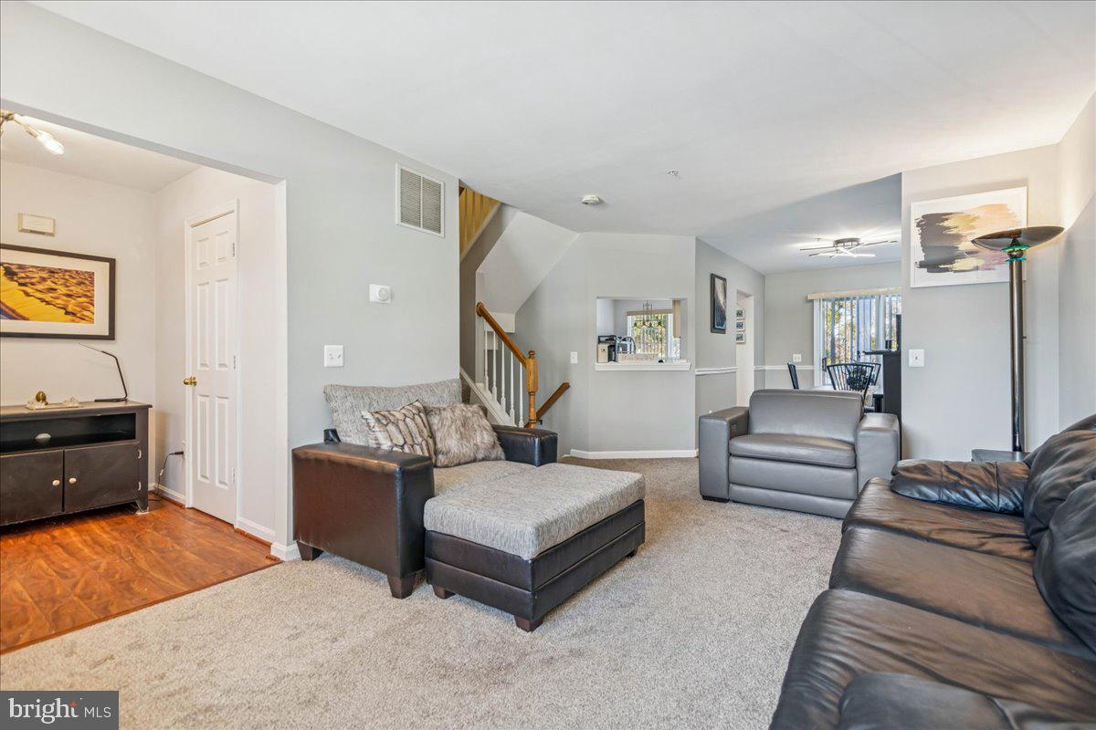 7536 Maury Road Windsor Mill, MD 21244 - Photo 7 of 36 a living room with furniture and wooden floor