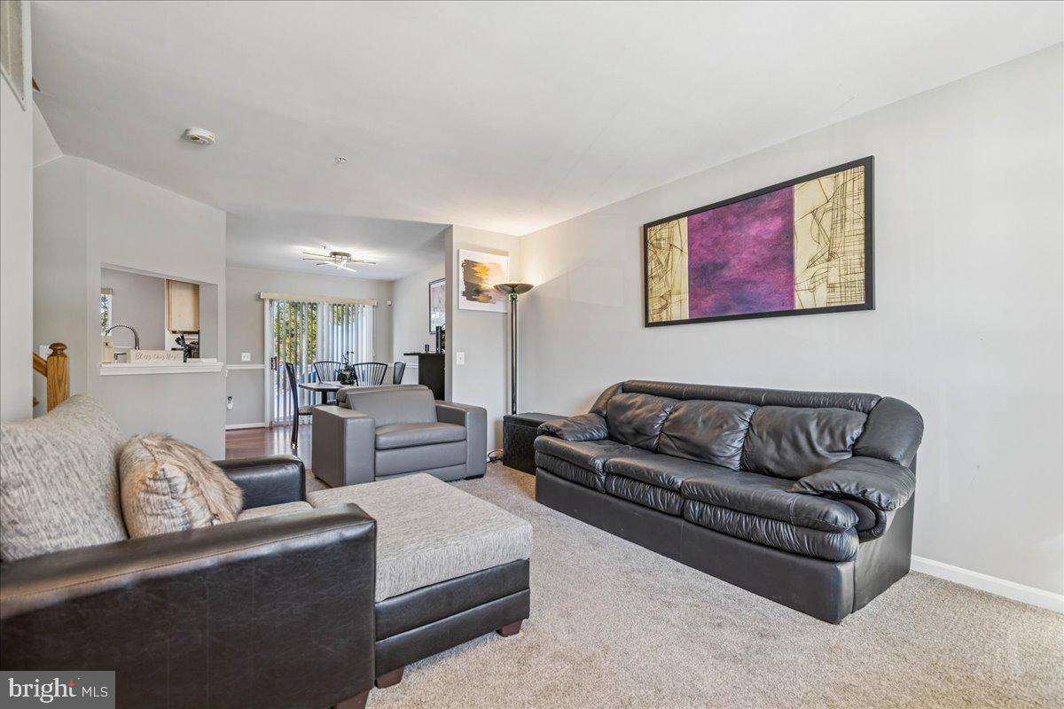 7536 Maury Road Windsor Mill, MD 21244 - Photo 8 of 36 a living room with furniture and a couch