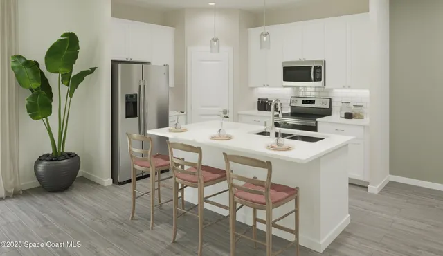 a dining room with furniture and a potted plant