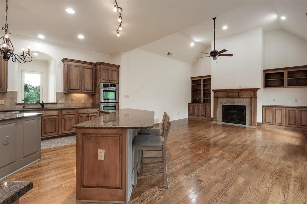 1185 Braystone Trail Collierville, TN 38017 - Photo 5 of 39 a kitchen with kitchen island a sink stainless steel appliances and cabinets