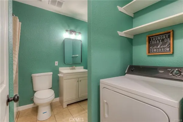 a bathroom with a toilet and a sink