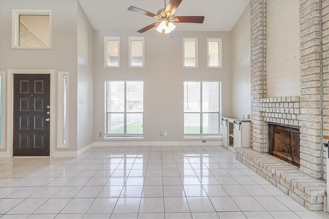 2938 River Crest Road Corpus Christi, TX 78415 - Photo 7 of 39 a view of an empty room with window and fireplace