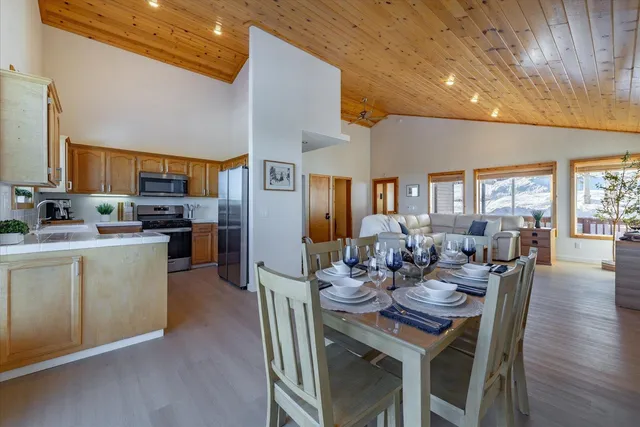 a bathroom with a double vanity sink toilet mirror and shower
