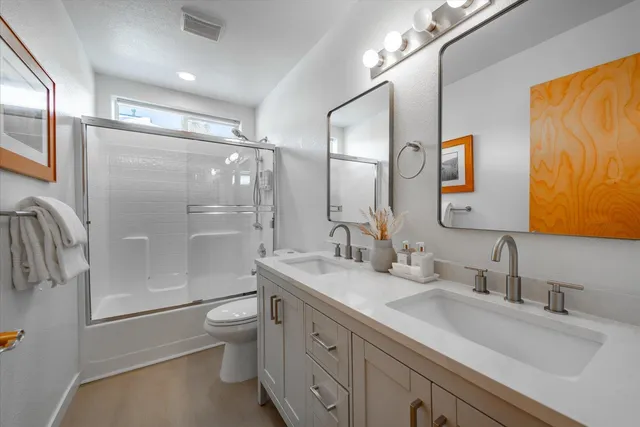 a living room with furniture and large windows