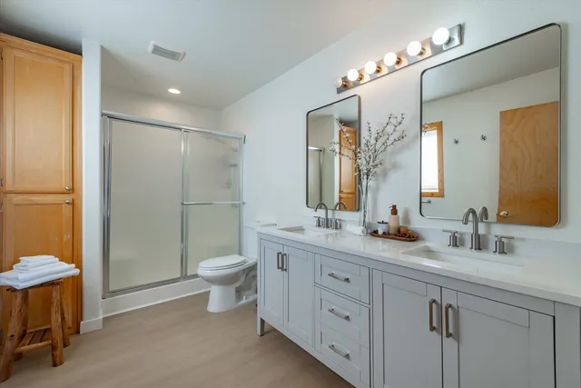 a kitchen with stainless steel appliances granite countertop a refrigerator stove and a sink