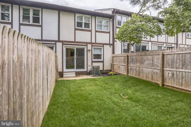 a view of a house with backyard and porch