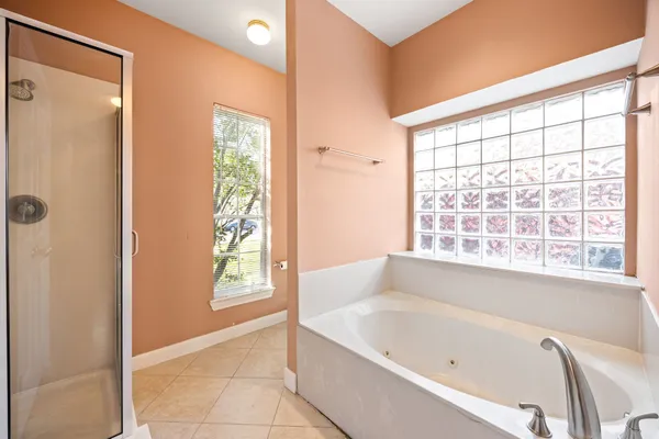 a bathroom with a bathtub and shower